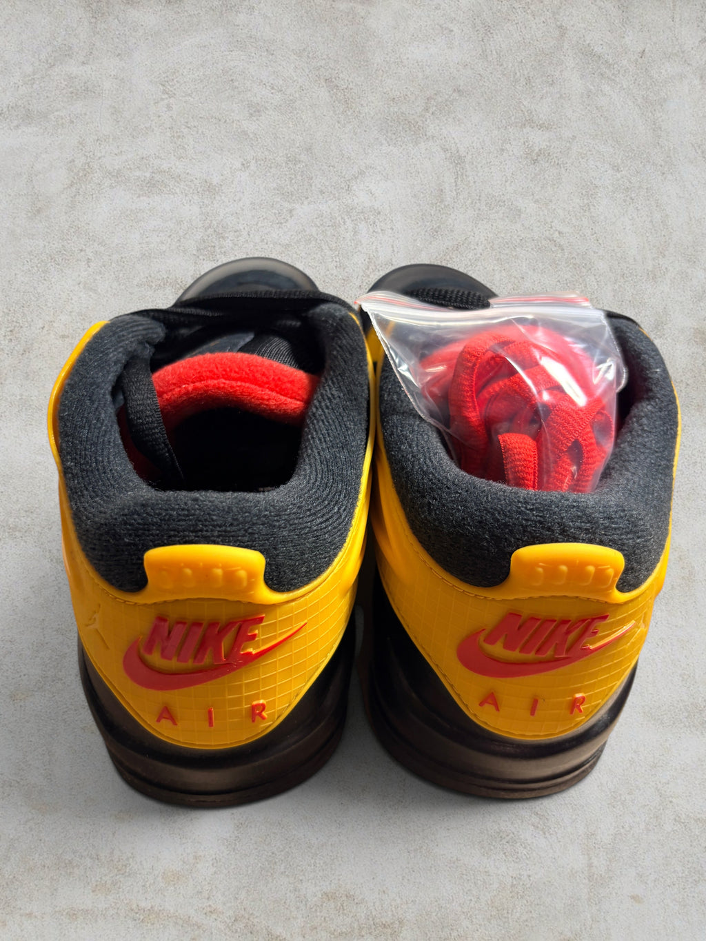 Air Jordan 4 RM "Bruce Lee" – Black / Del Sol (Neuf)