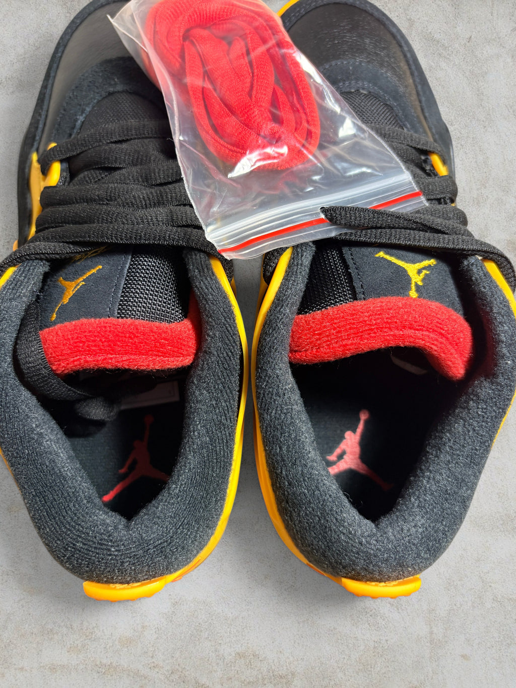 Air Jordan 4 RM "Bruce Lee" – Black / Del Sol (Neuf)