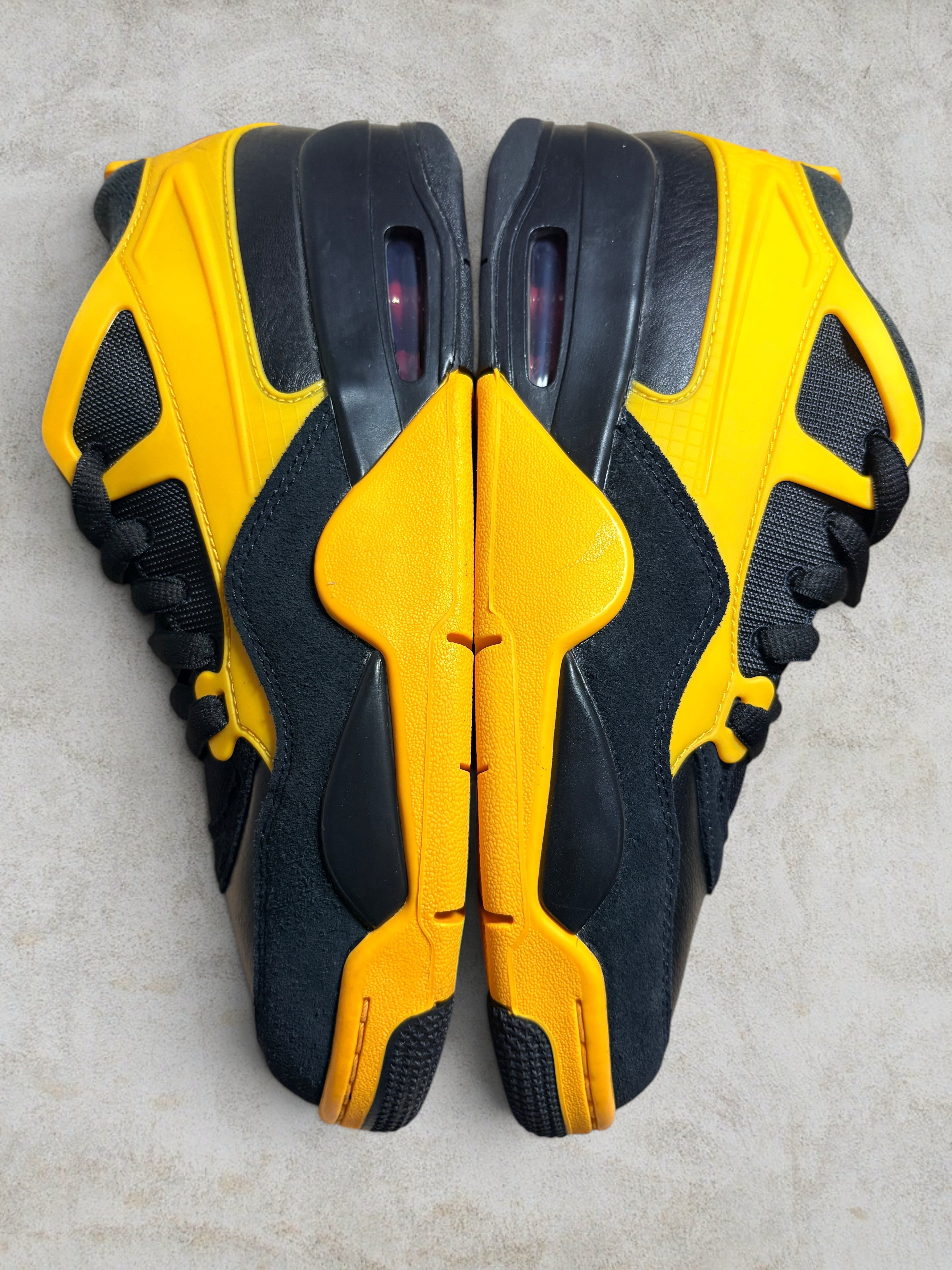Air Jordan 4 RM "Bruce Lee" – Black / Del Sol (Neuf)