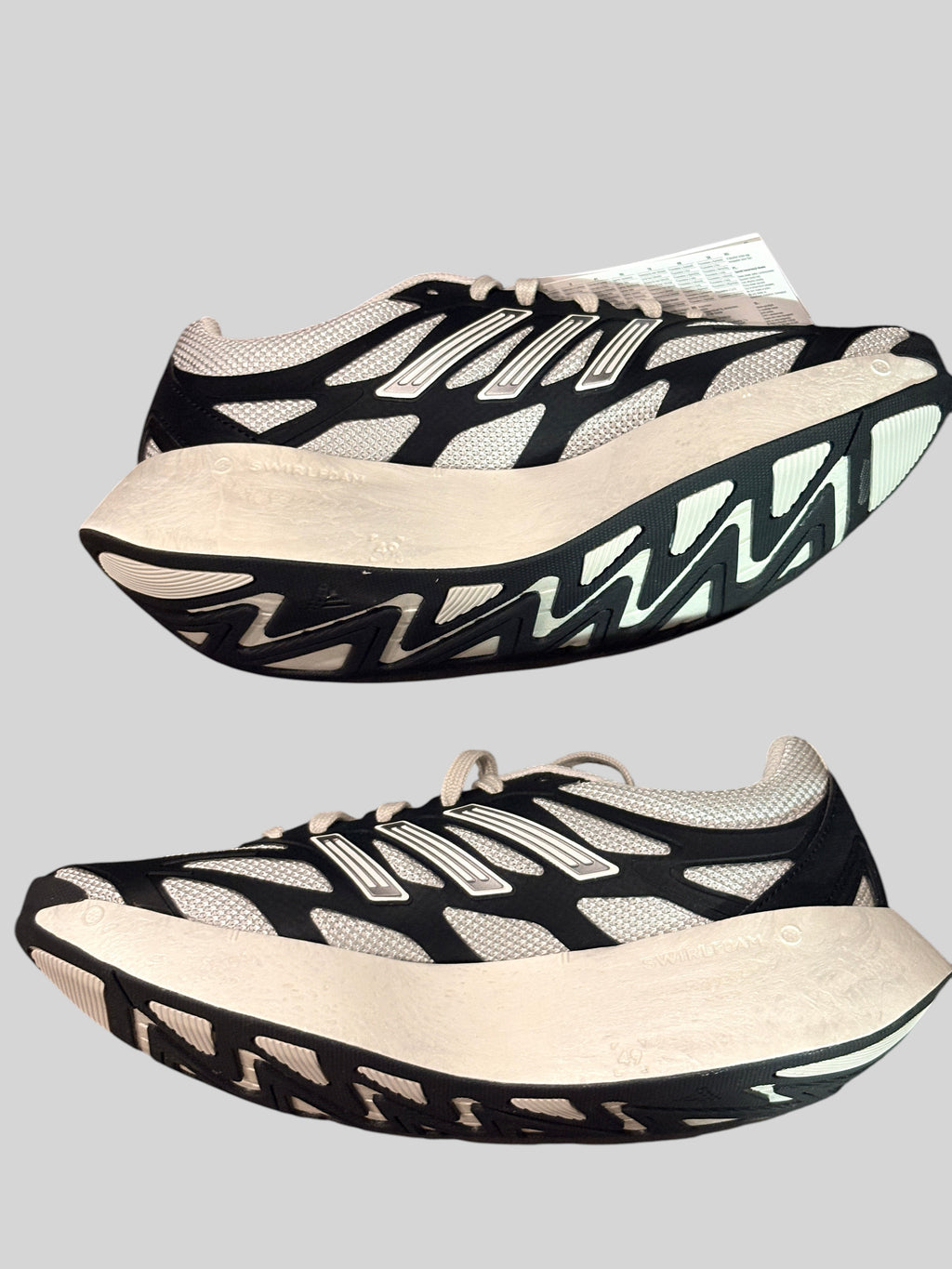 Baskets FASHION SC Adidas Adizero Aruku noir et blanc avec semelle incurvée Swirlfoam et tige textile légère