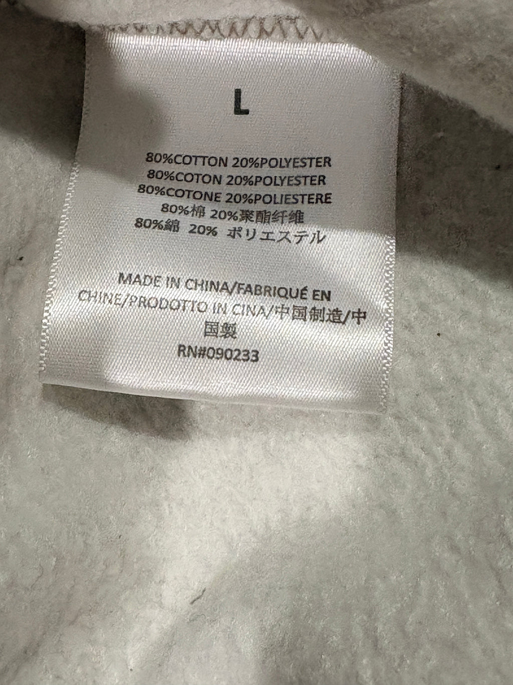 Étiquette de composition intérieure du pantalon Fear of God ESSENTIALS 1977 chez FASHION SC indiquant 80% coton
