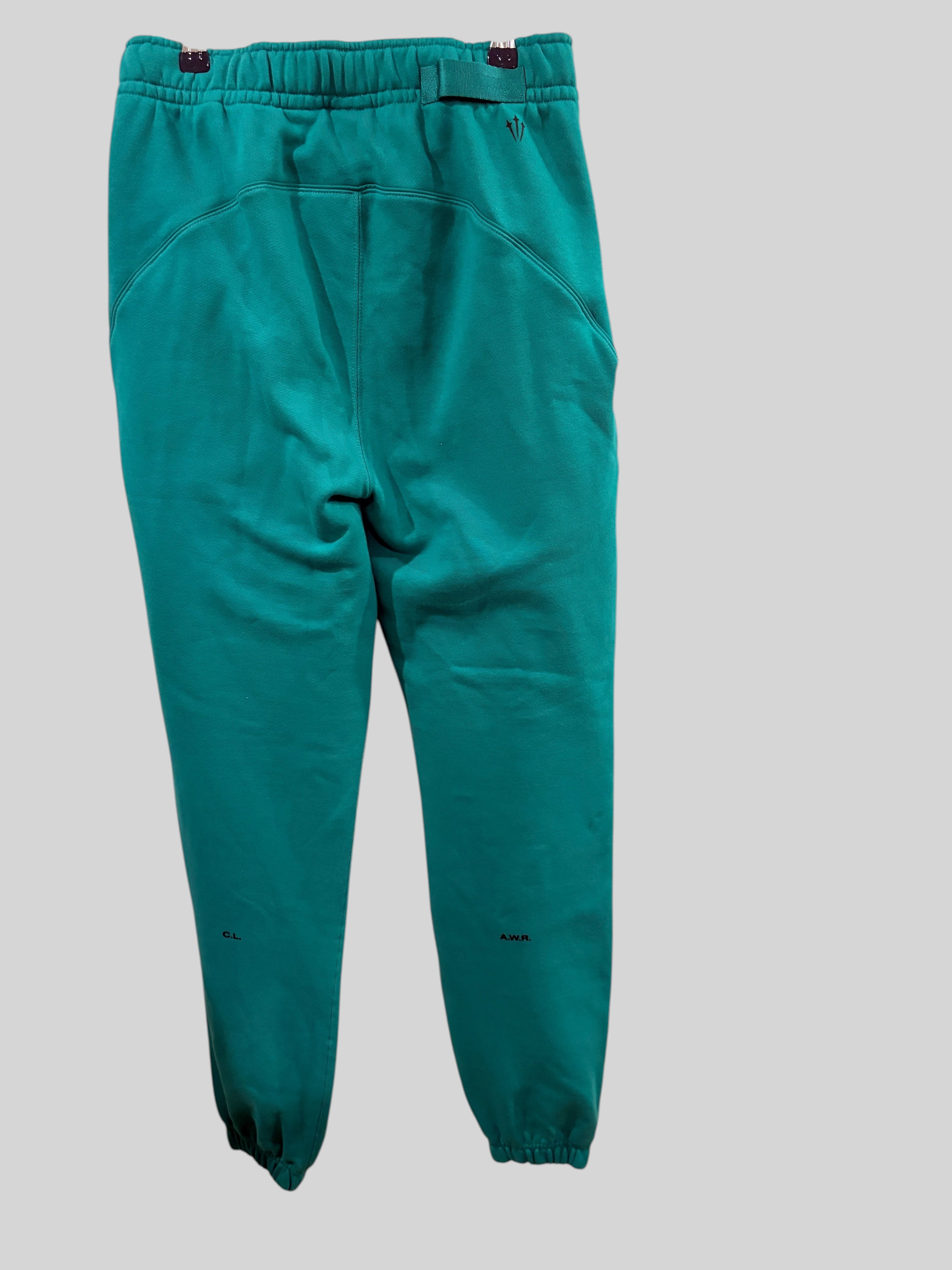 Pantalon de survêtement FASHION SC Nike x NOCTA Fleece CS vert Neptune avec détails noirs et chevilles élastiquées