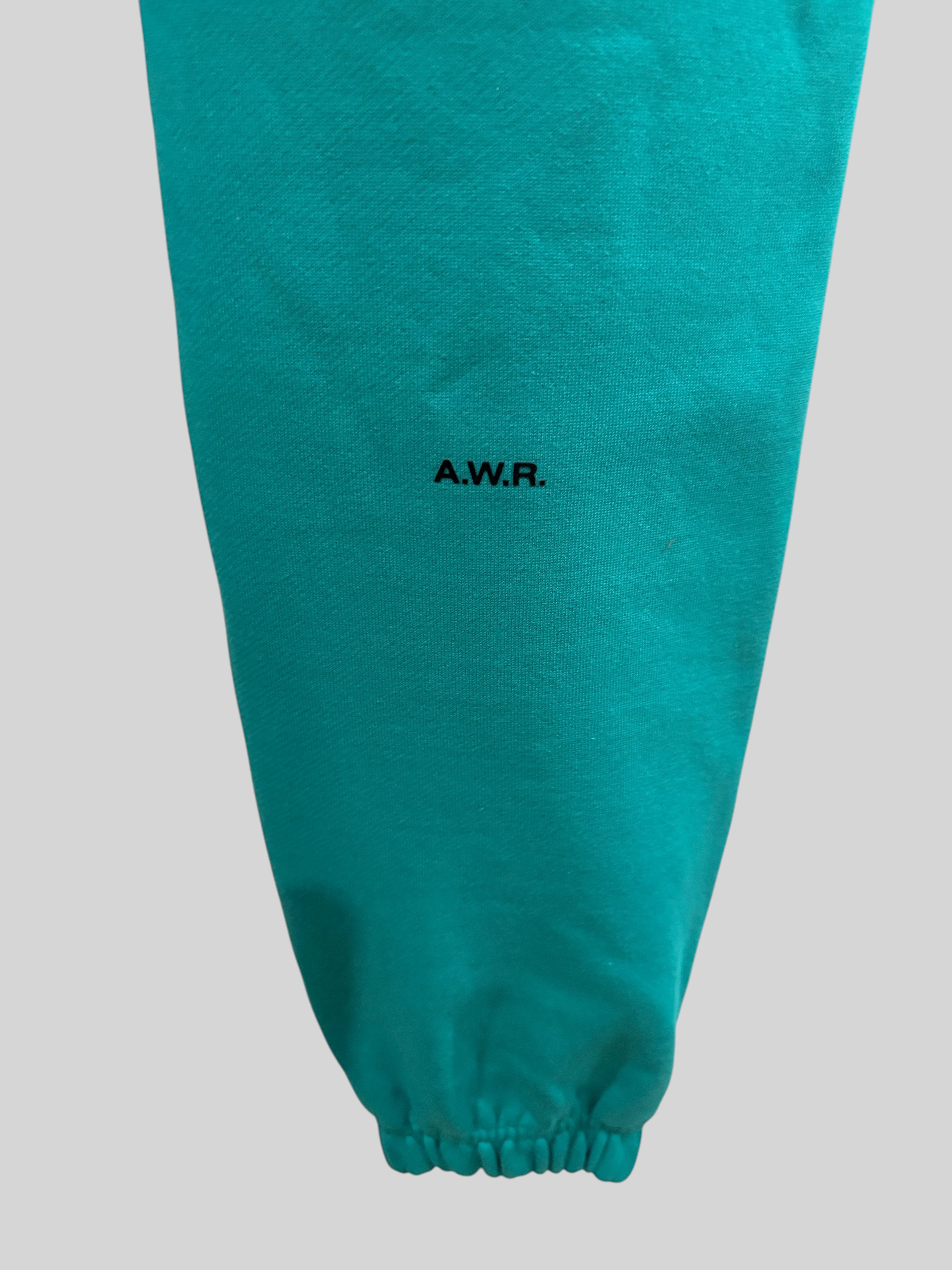 Pantalon de survêtement FASHION SC Nike x NOCTA en coton vert Neptune avec logo noir et cheville élastiquée