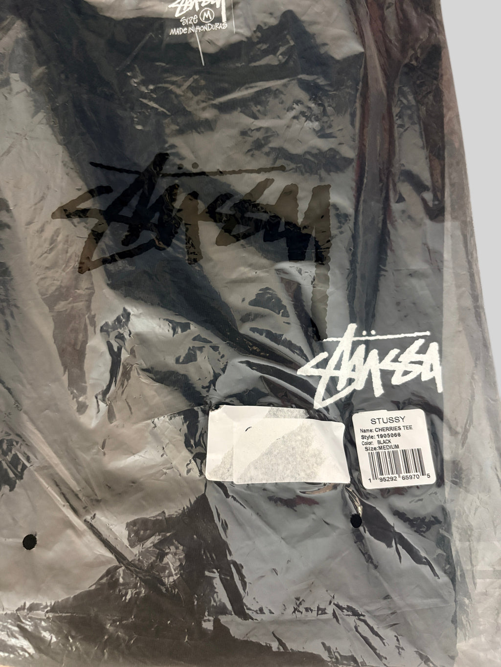T-shirt noir Stüssy Cherries Tee neuf dans son emballage plastique d'origine avec étiquette de la boutique FASHION SC